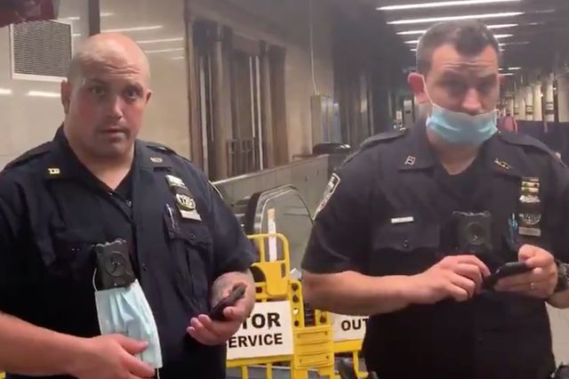 NYPD officers seen without masks on a subway earlier this summer